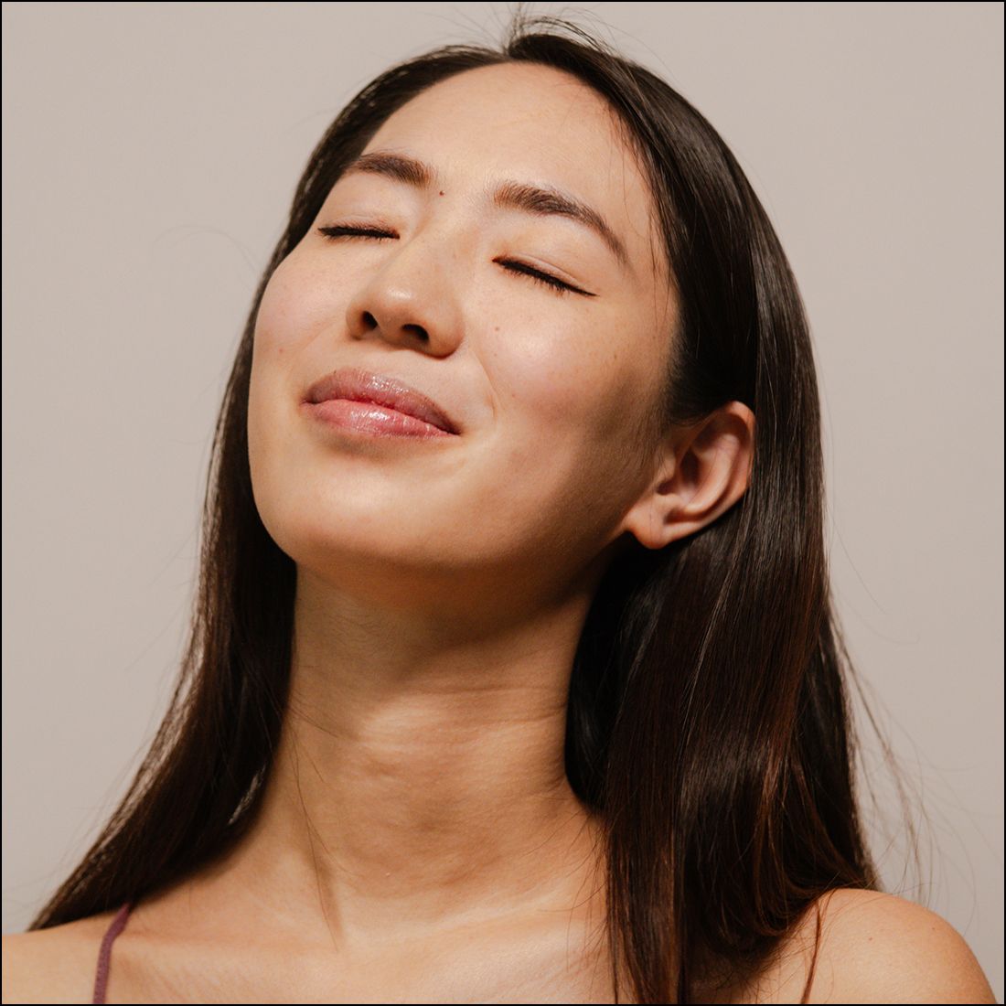 Woman with closed eyes, serene expression.