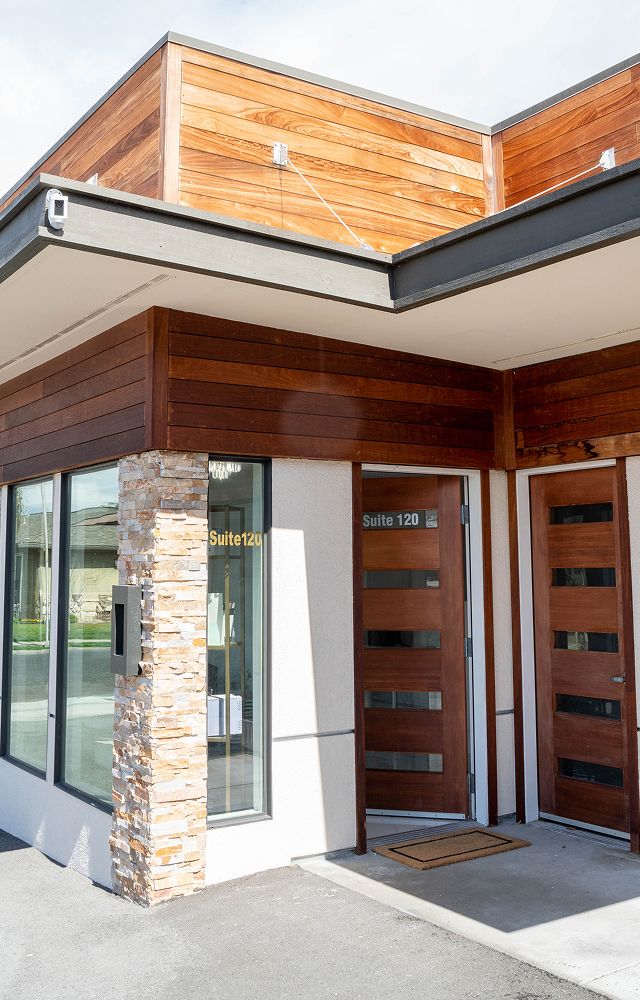Modern entrance to Suite 120 with wood accents.