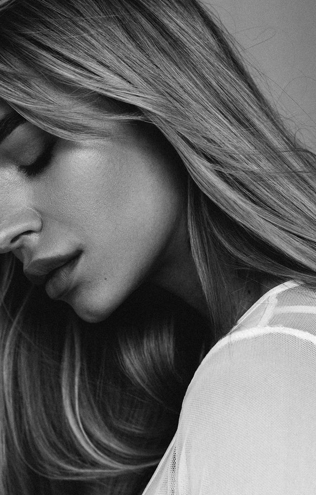 Black and white portrait of a woman’s profile.