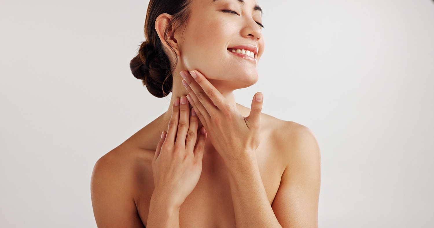 Laser hair removal model with long brown hair and blue eyes.