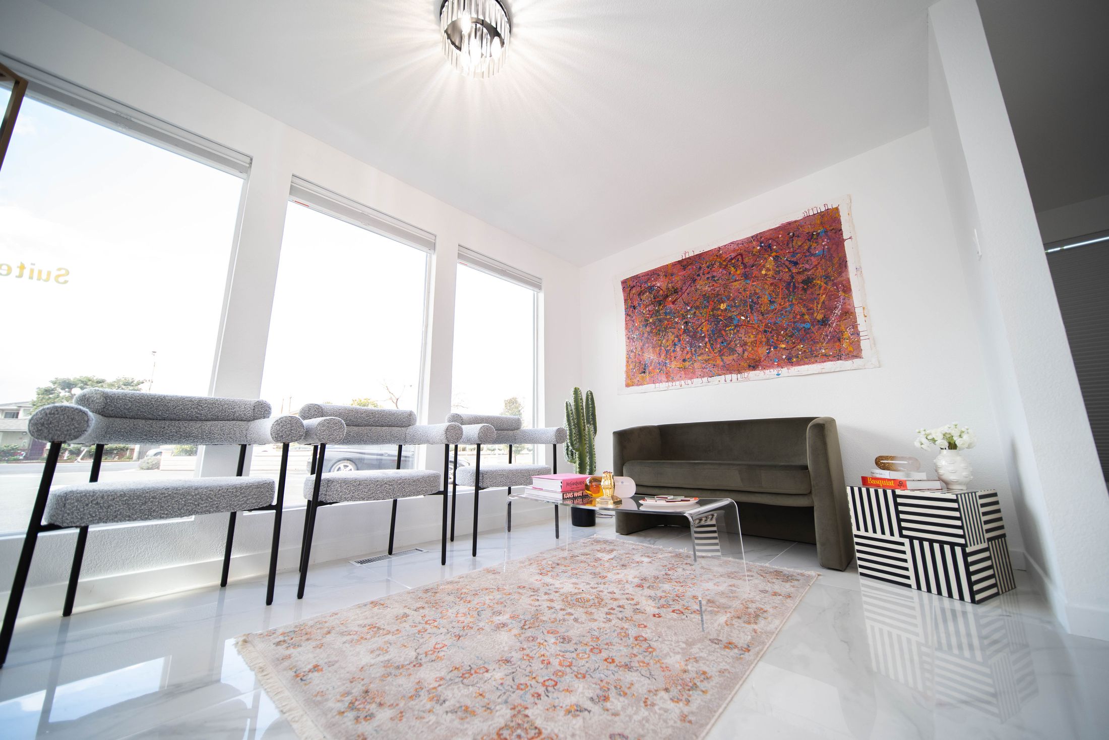 Modern waiting area with art and comfortable seating.